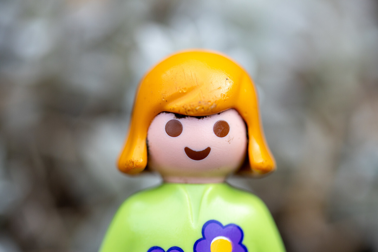 Smiling girl toy figure portrait