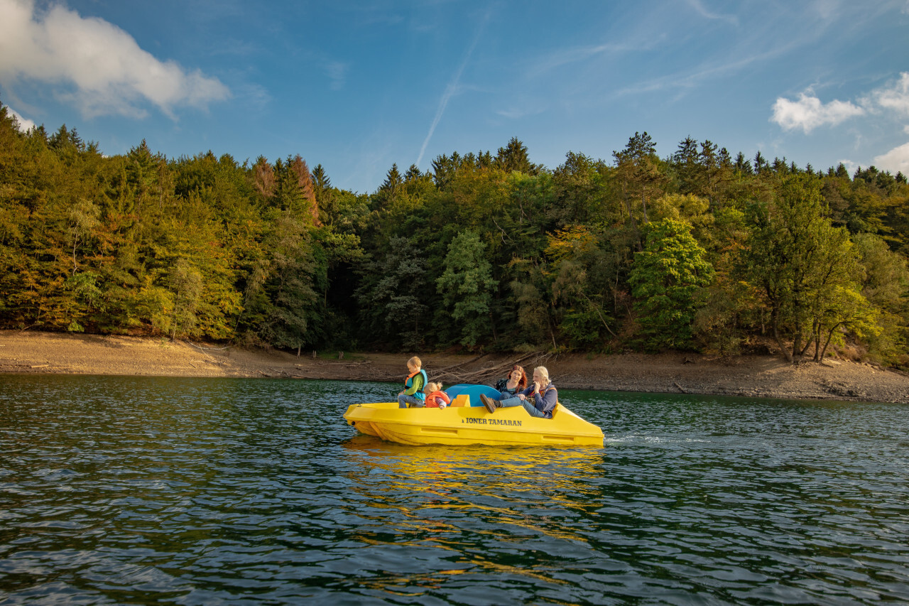 Family in yellow boat on a lake