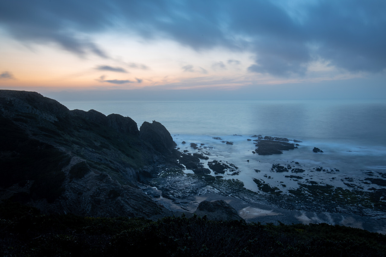 Blue hour cliffs the water seascape by Portugal