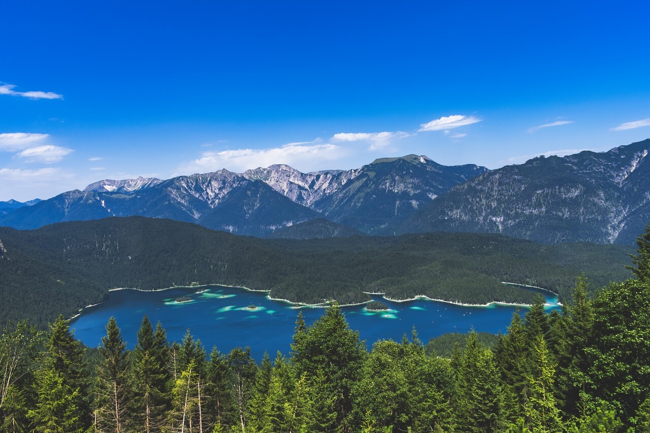 Alpine landscape with the Eibsee lake against mountains