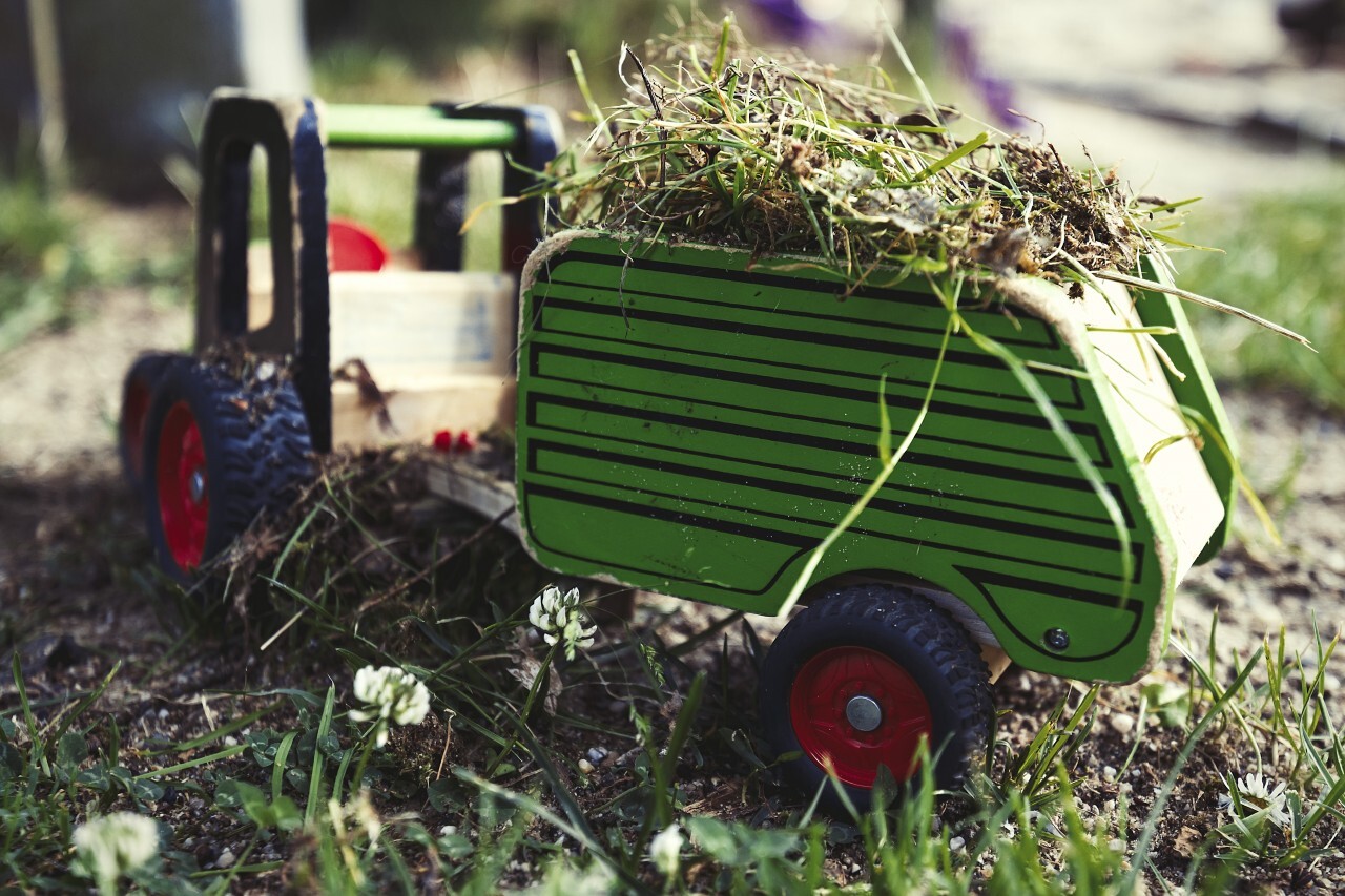 toy tractor loaded with grass