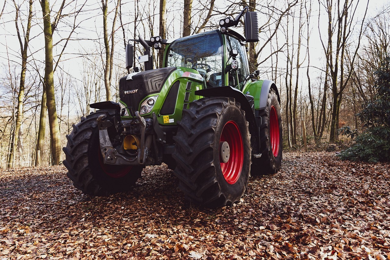 green tractor in the forest