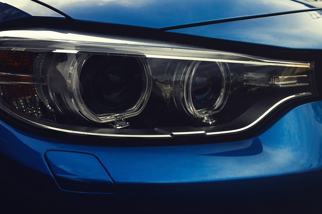 Modern car headlight, Blue car exterior detail