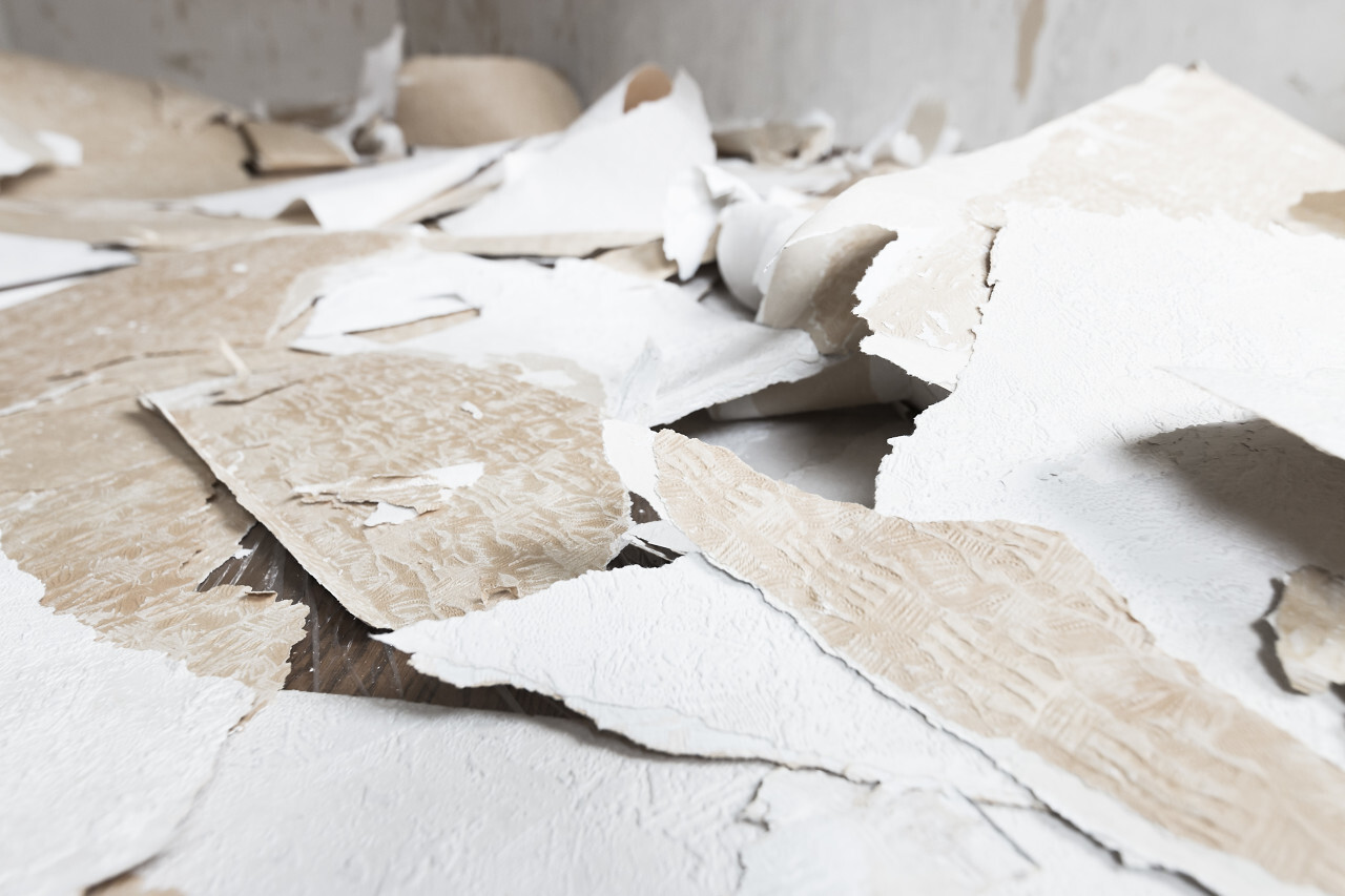 renovation work old wallpaper on the floor