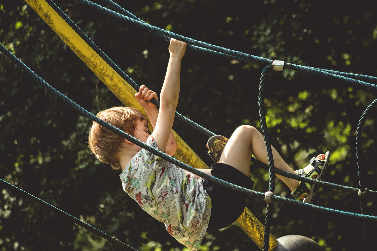 Young boy playing at a playground