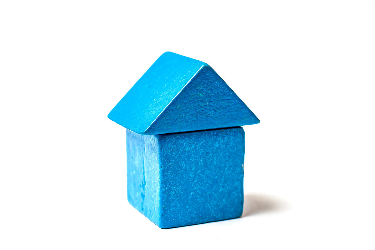 blue toy block house white background