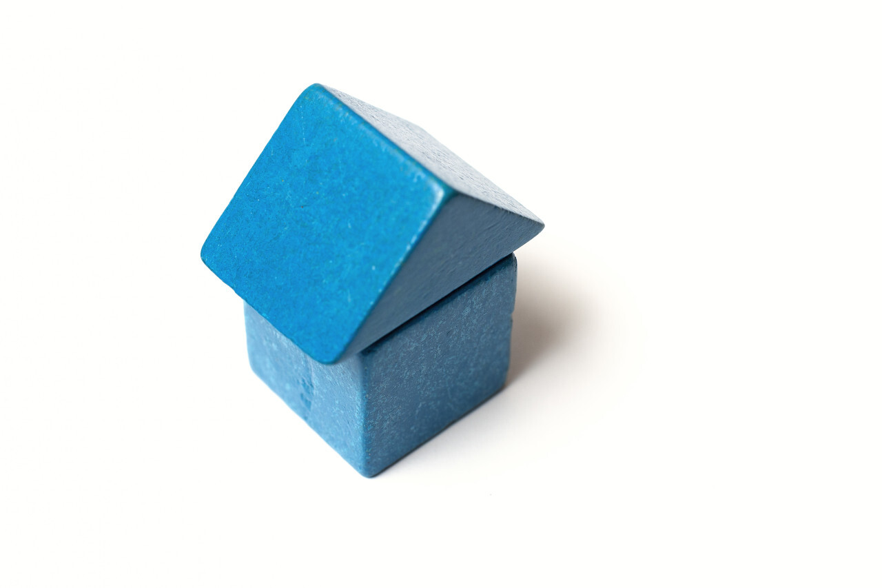 blue toy block house white background