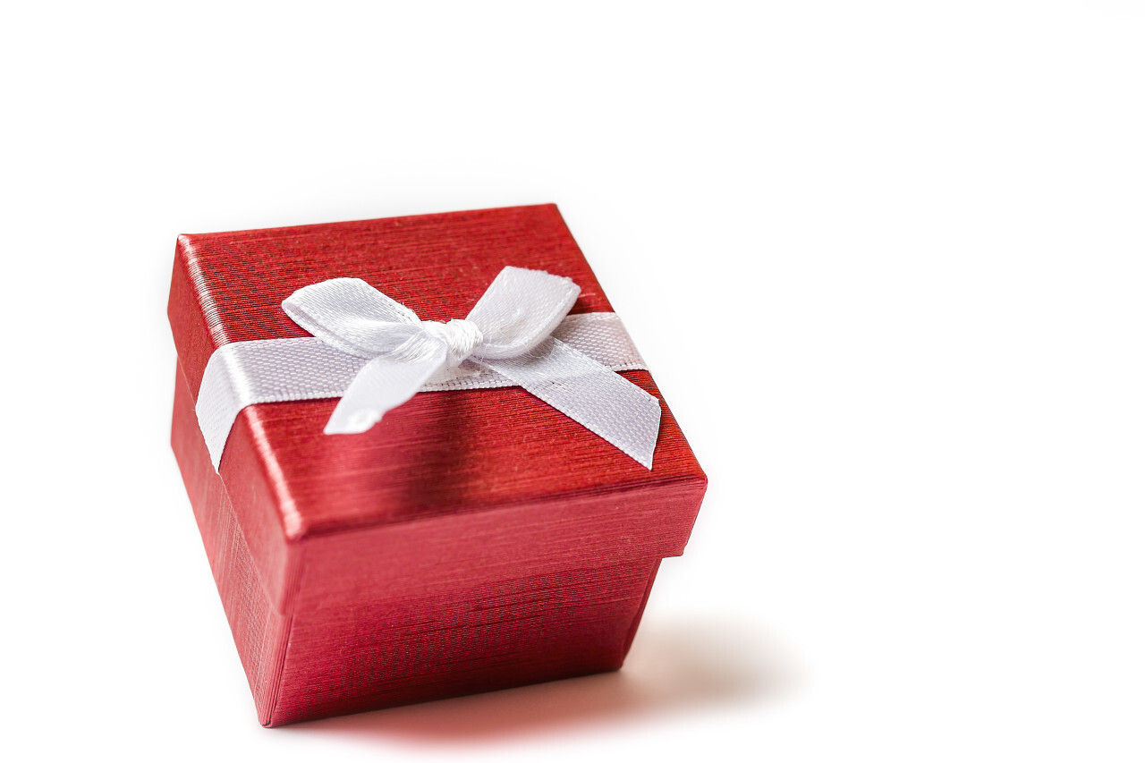 red wrapped gift box isolated on white background