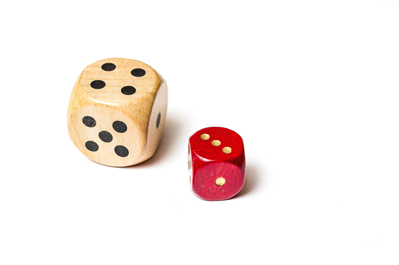 small red and big white dice isolated on white background