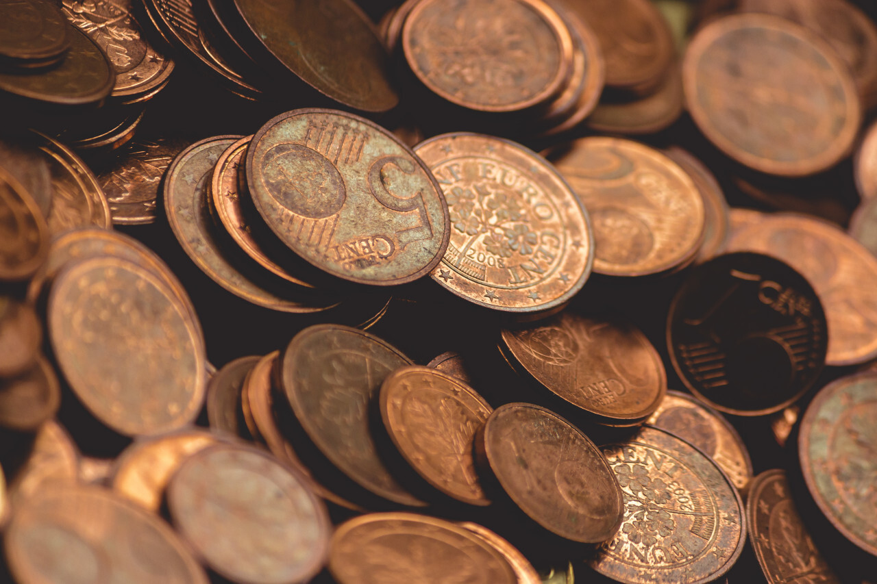 1 cent euro coins, 2 cent euro coins and 5 cent euro coins. Pile of euro cent coins.