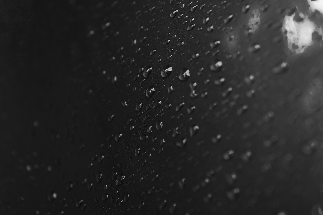 raindrops on a black surface background