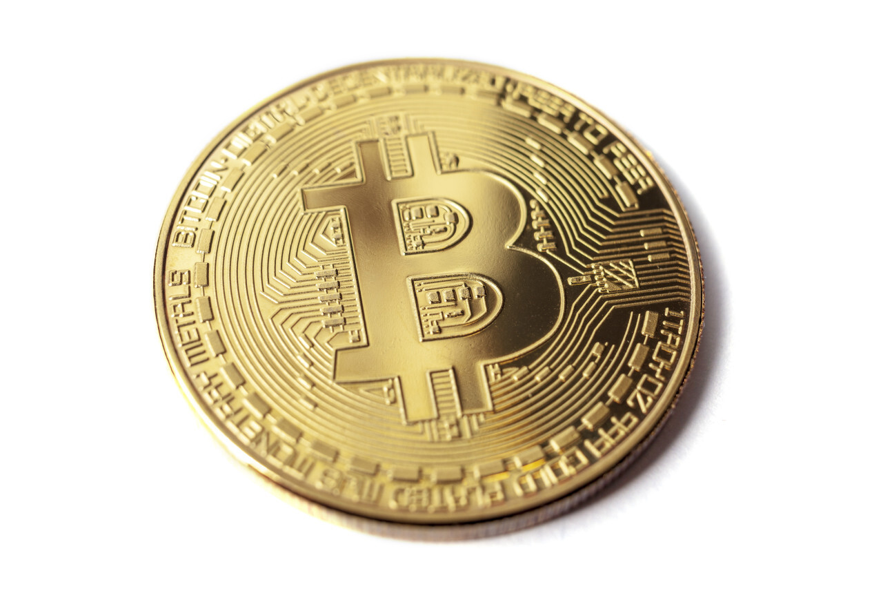 Golden bitcoin isolated on a white background