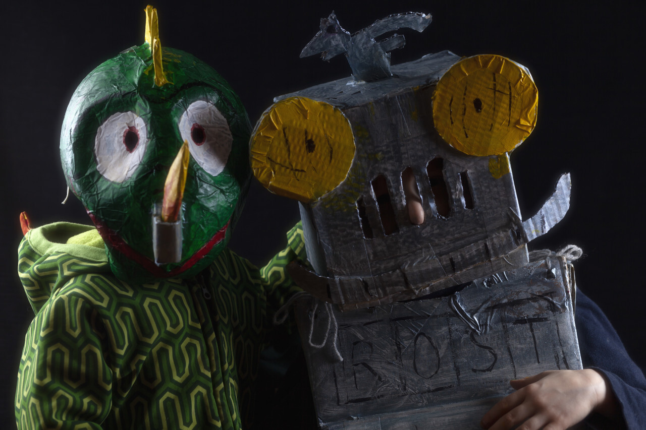 Two children dressed as robots and dragons for carnival