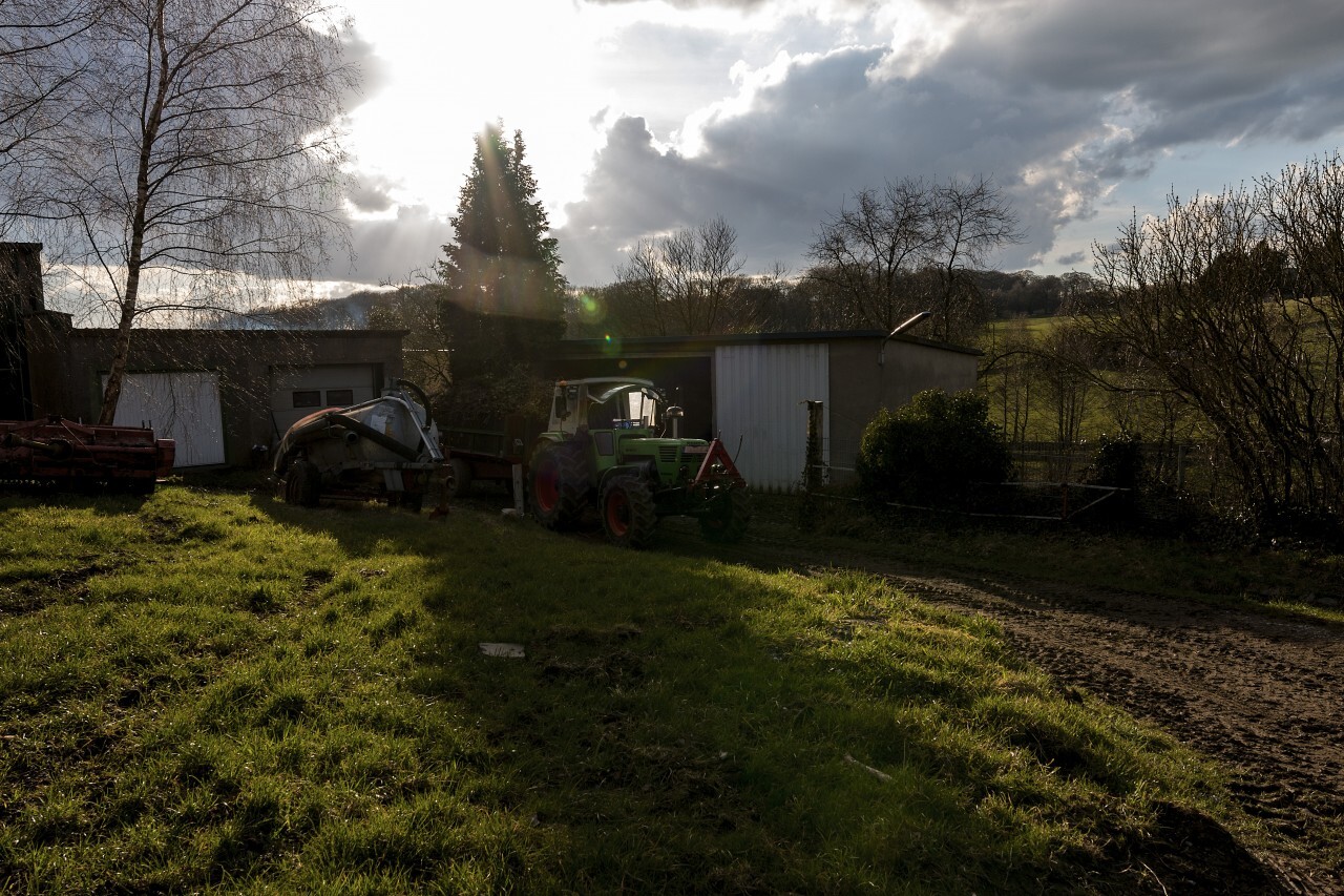 green tractor on a farm