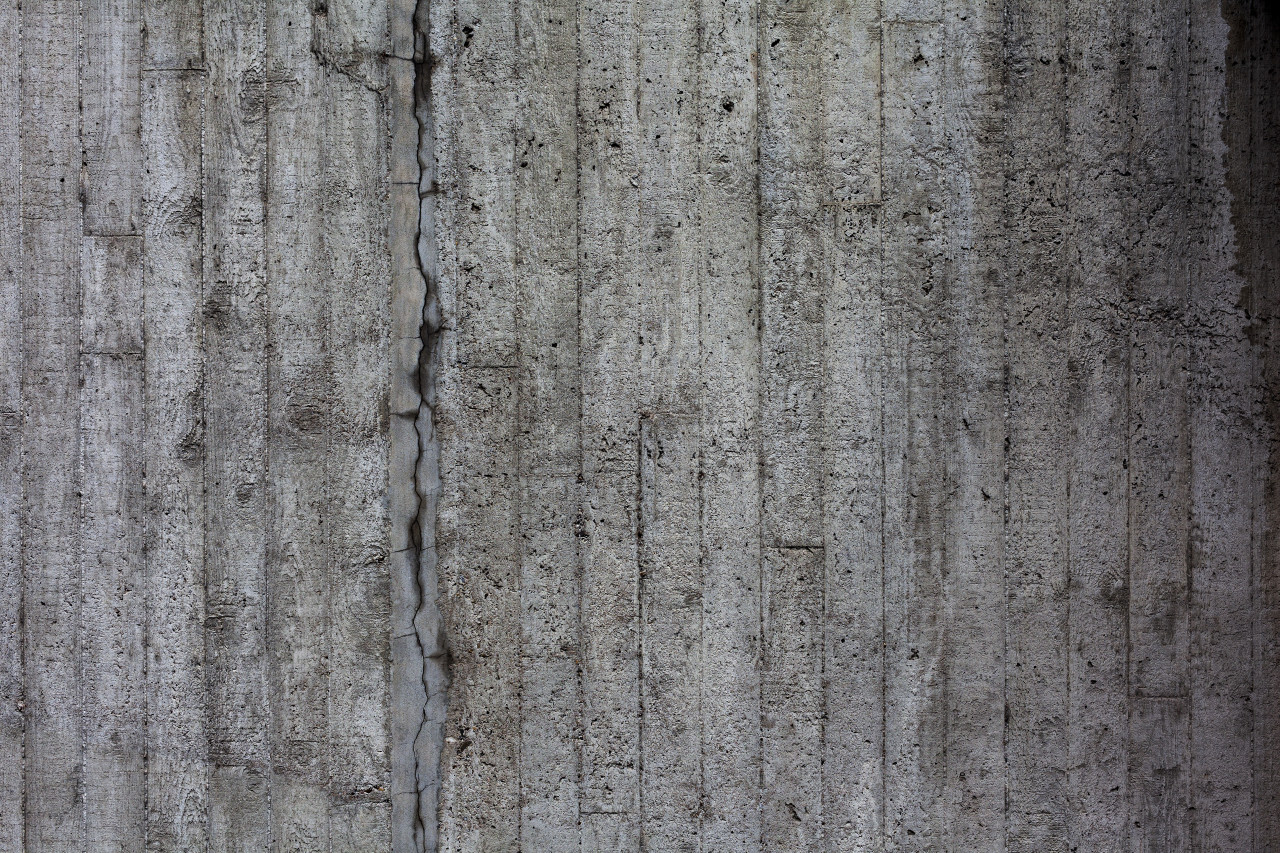 concrete stone wall texture with cracks background