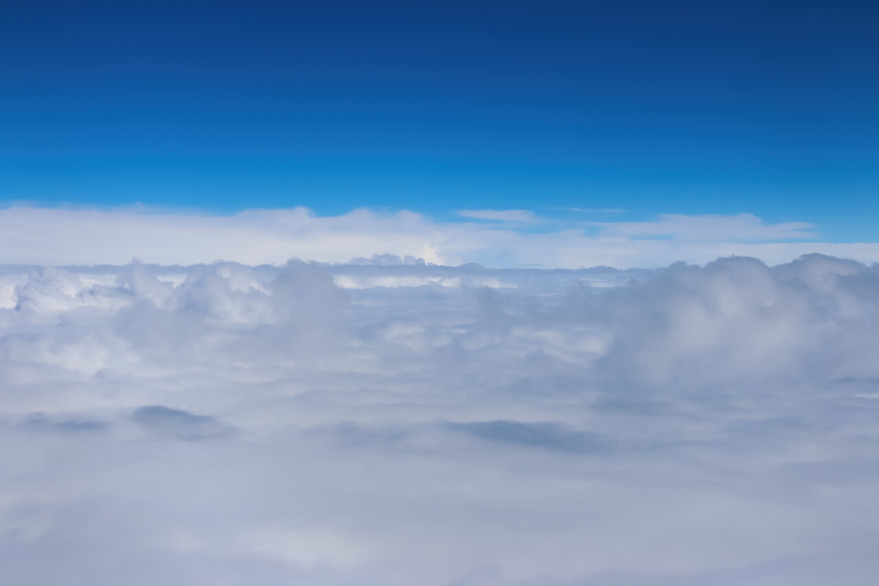 Clouds and sky from airplane window view