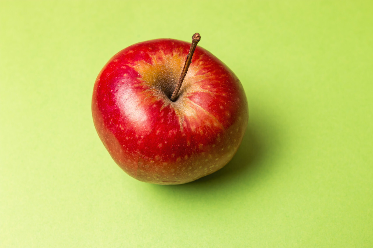 red apple green background