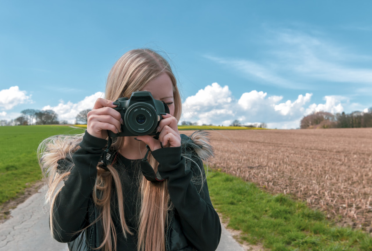 young girl with camera - female photographer