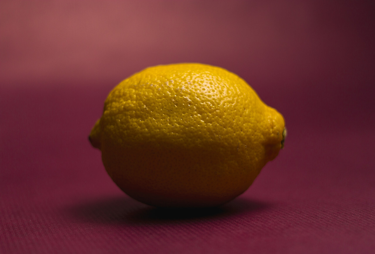 yellow lemon lime on a pink background