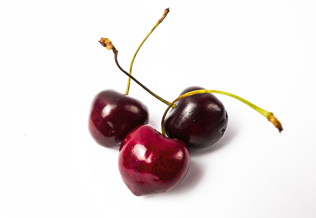 three cherries isolated on white background