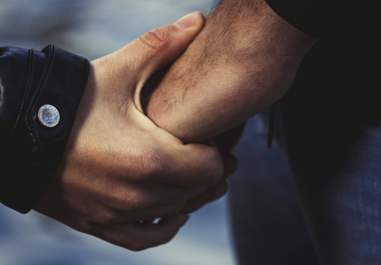 couple is holding hands