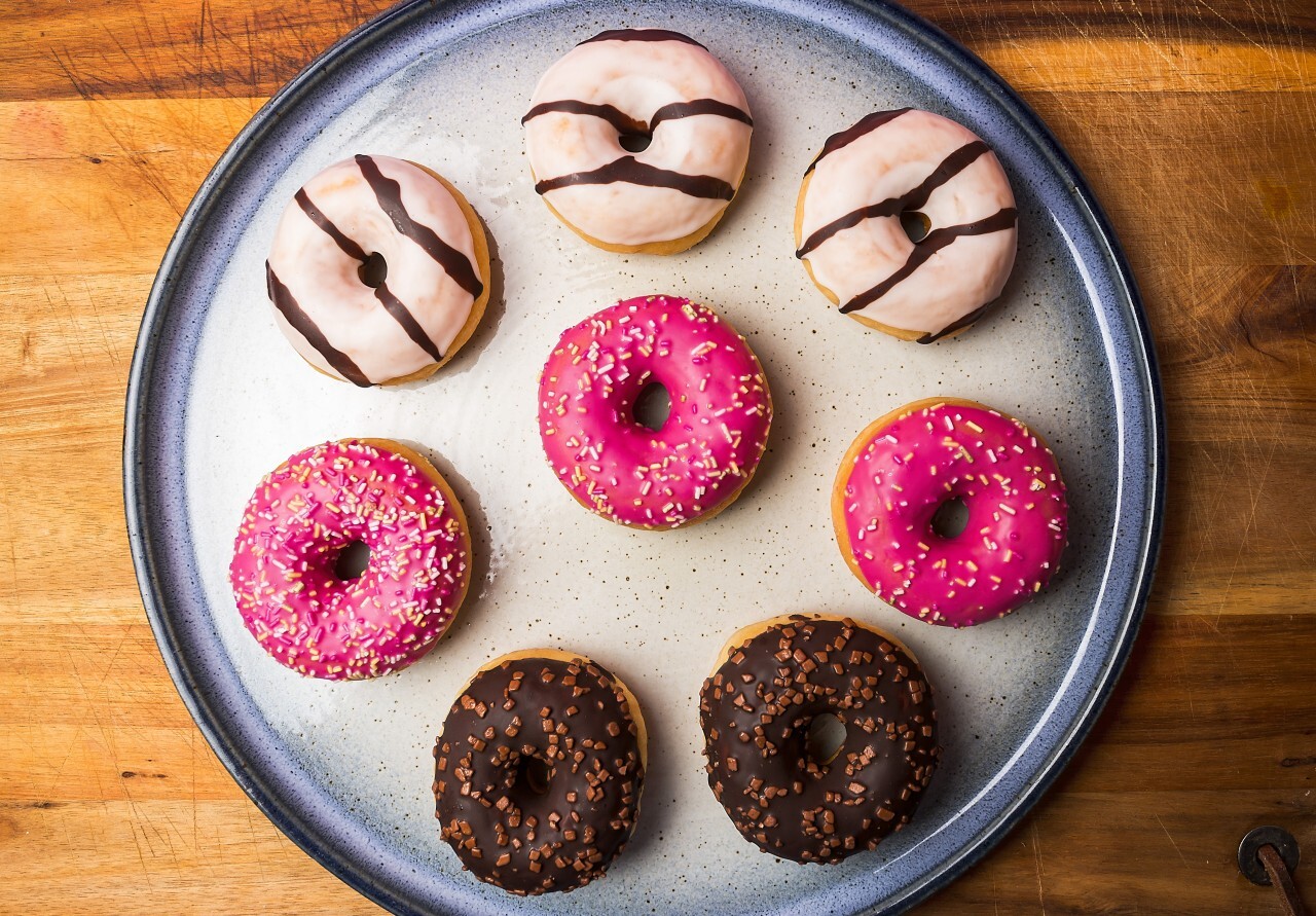 mixed donuts on a plate wood background