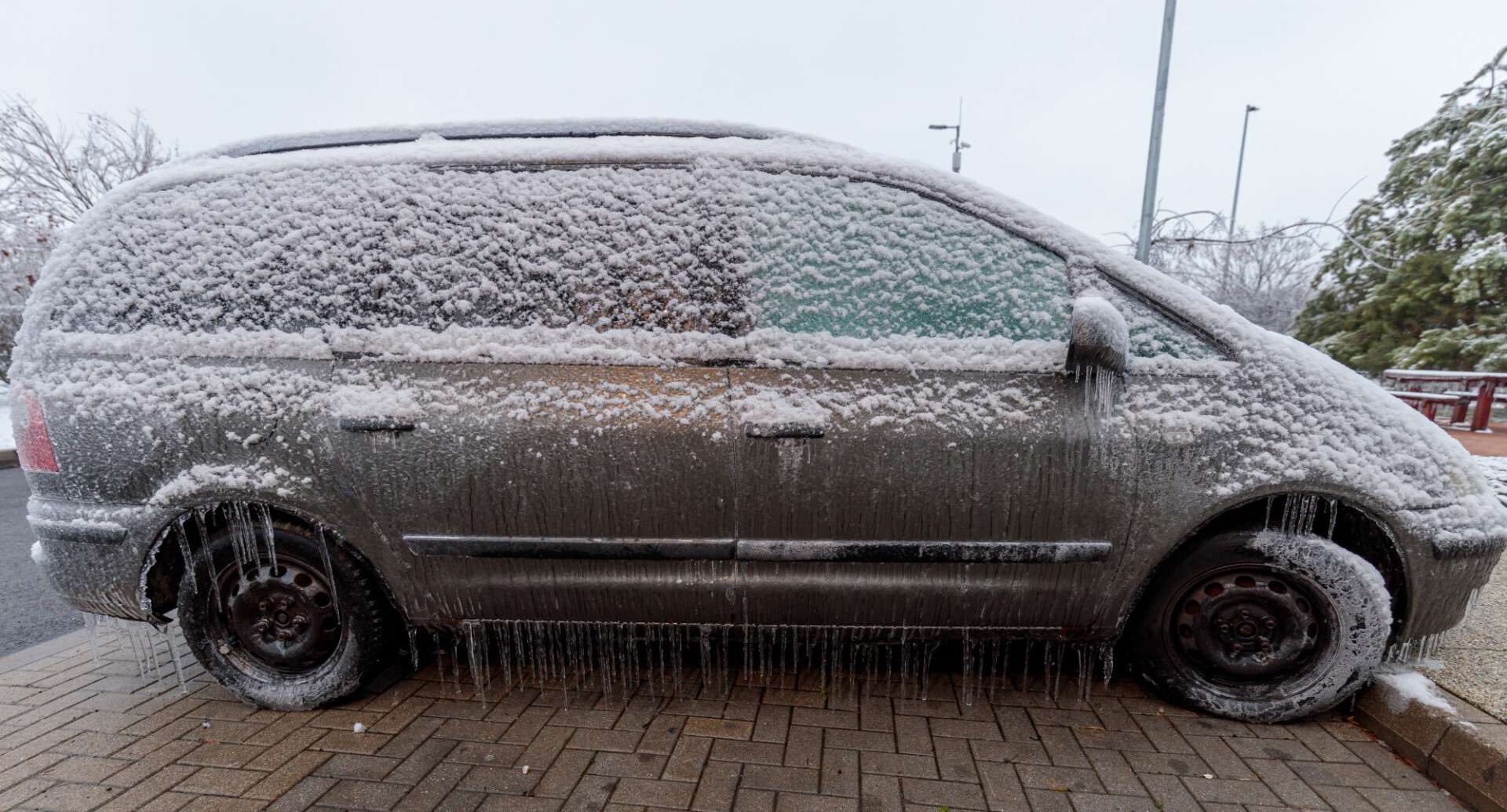 Car completely covered with ice and snow