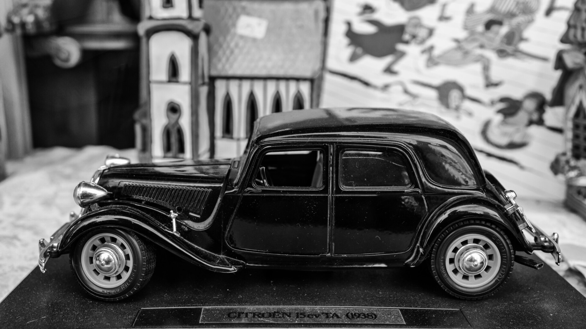 Model car in a window of an antiques shop