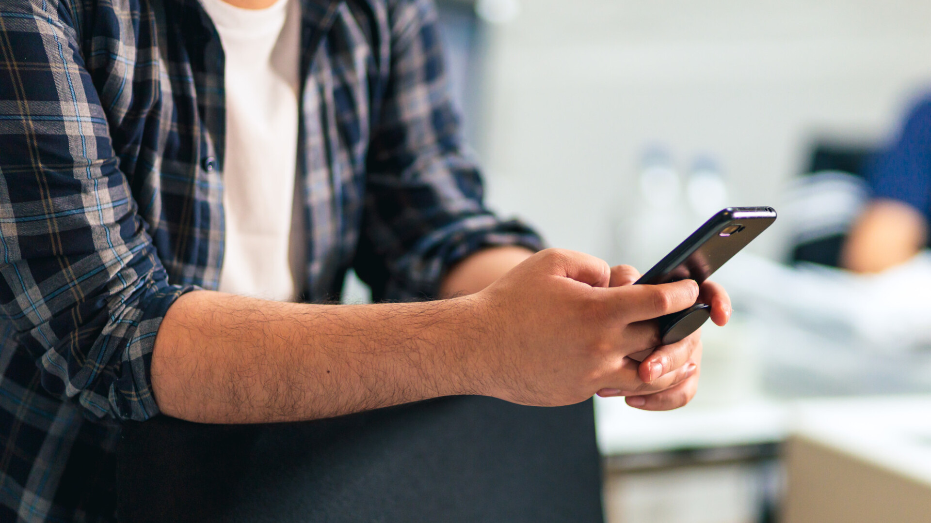 Man uses his mobile phone