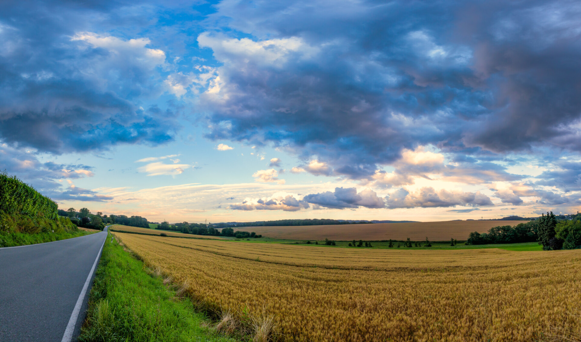 German country road with stormy clouds