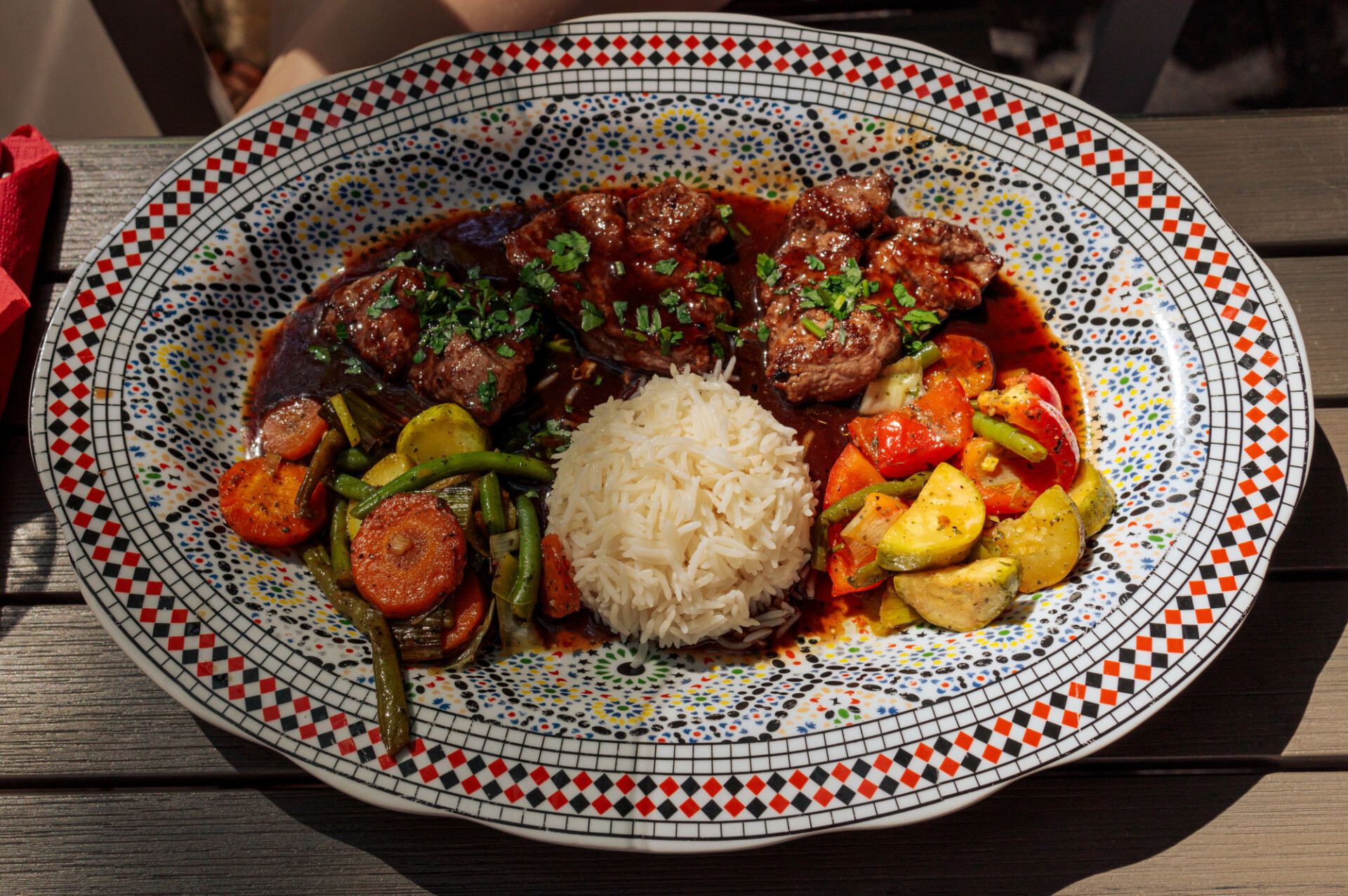 Arabian plate with lamb fillet served with rice and grilled vegetables