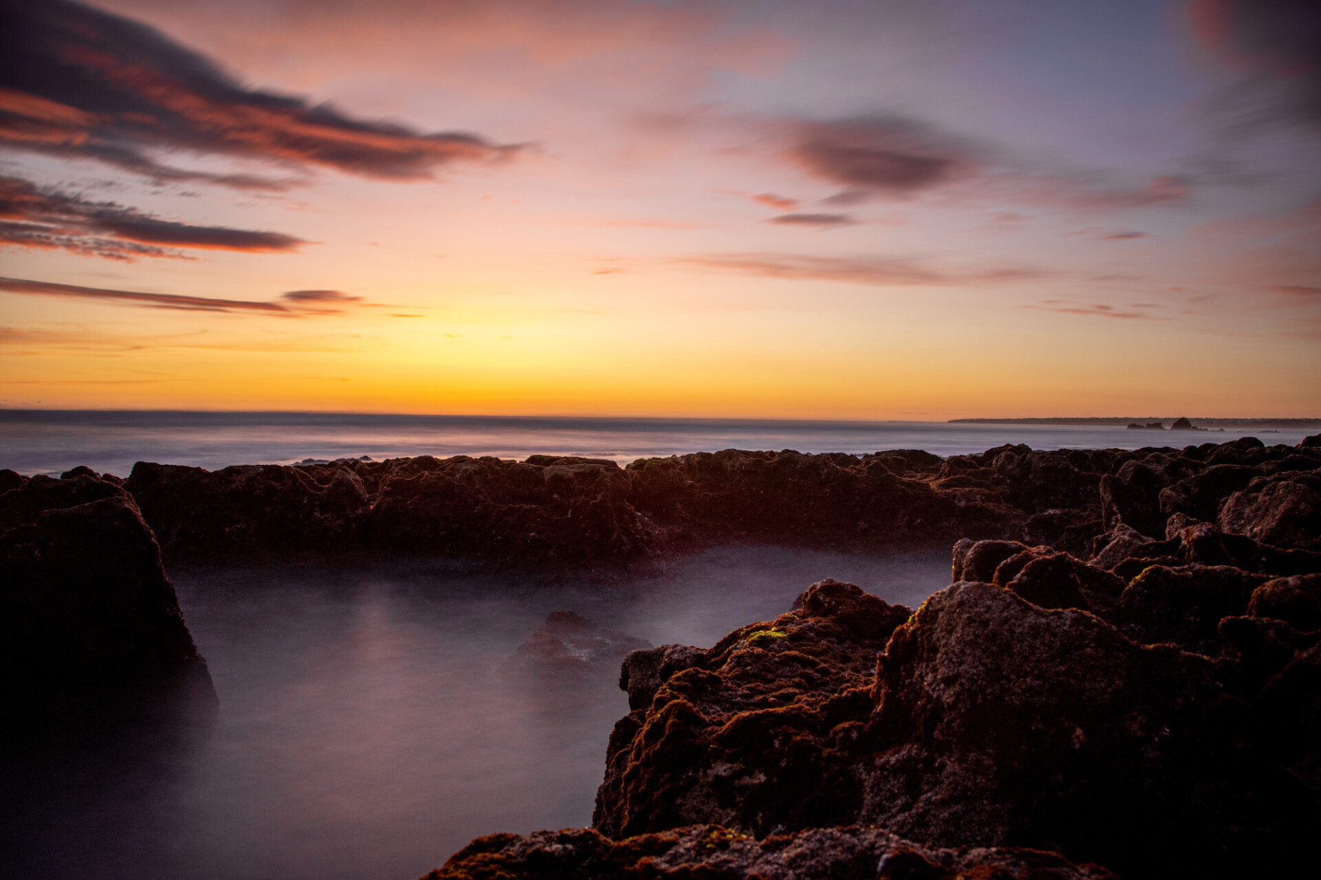 Wonderful sunset on the rocky beach of Portugal