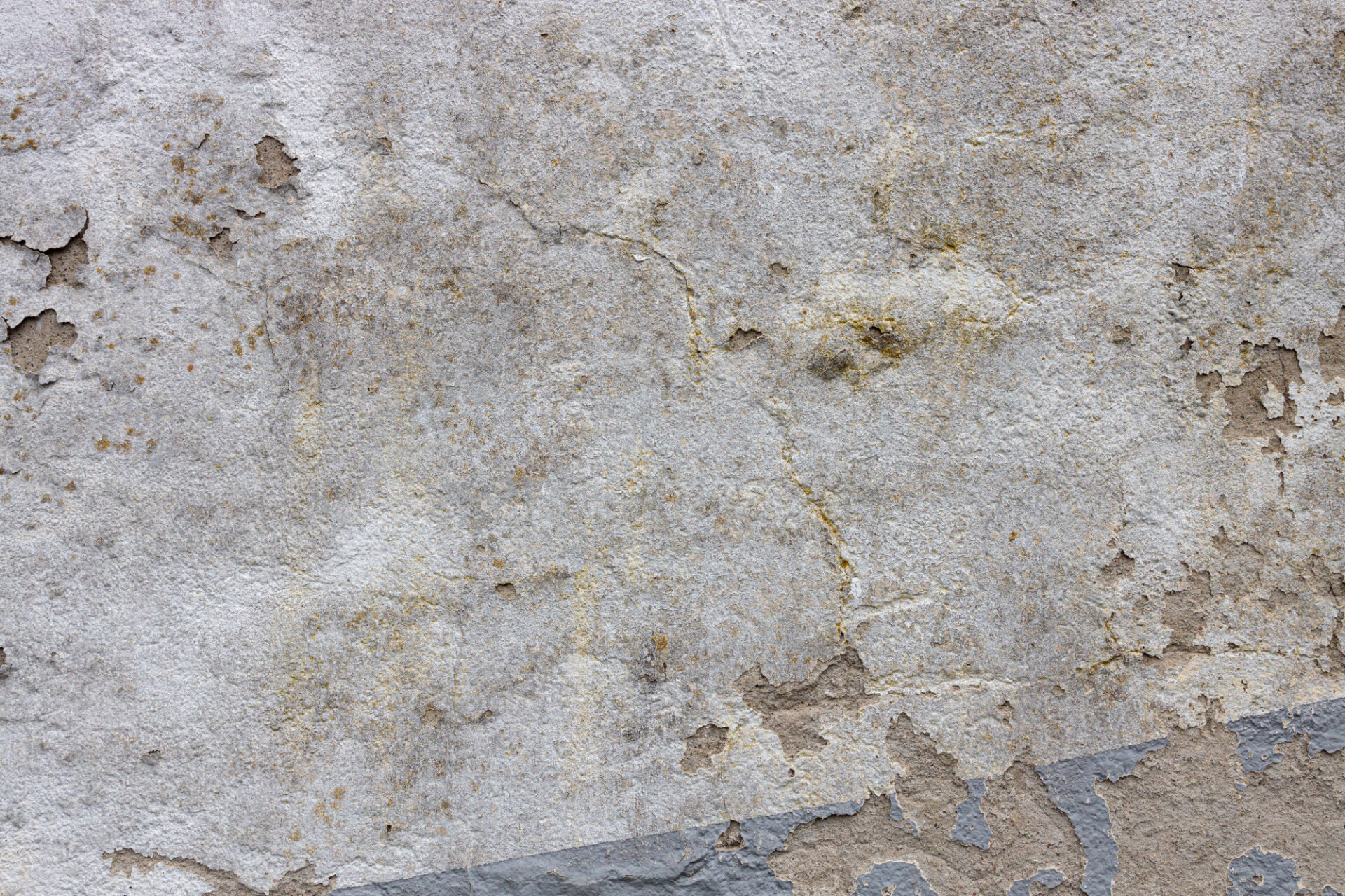 Concrete wall with large signs of wear background