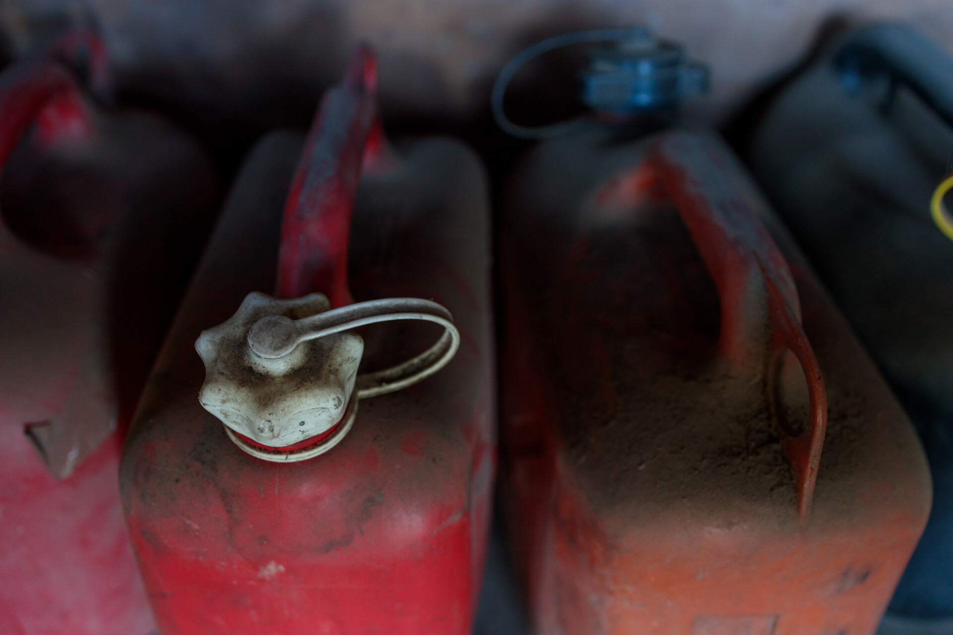 Old red canisters in a shed