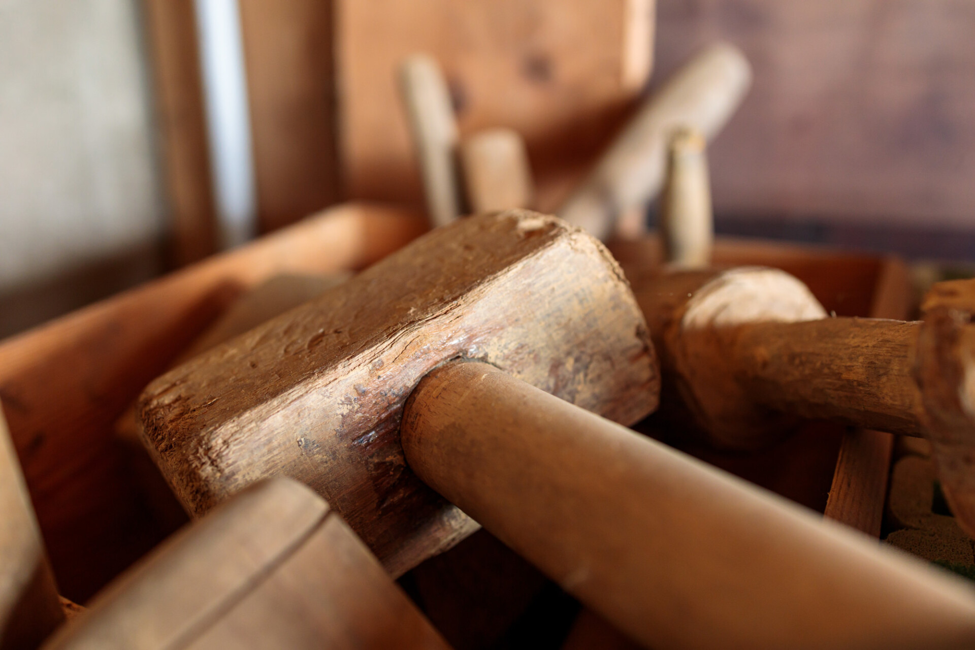 Box full of wooden hammers