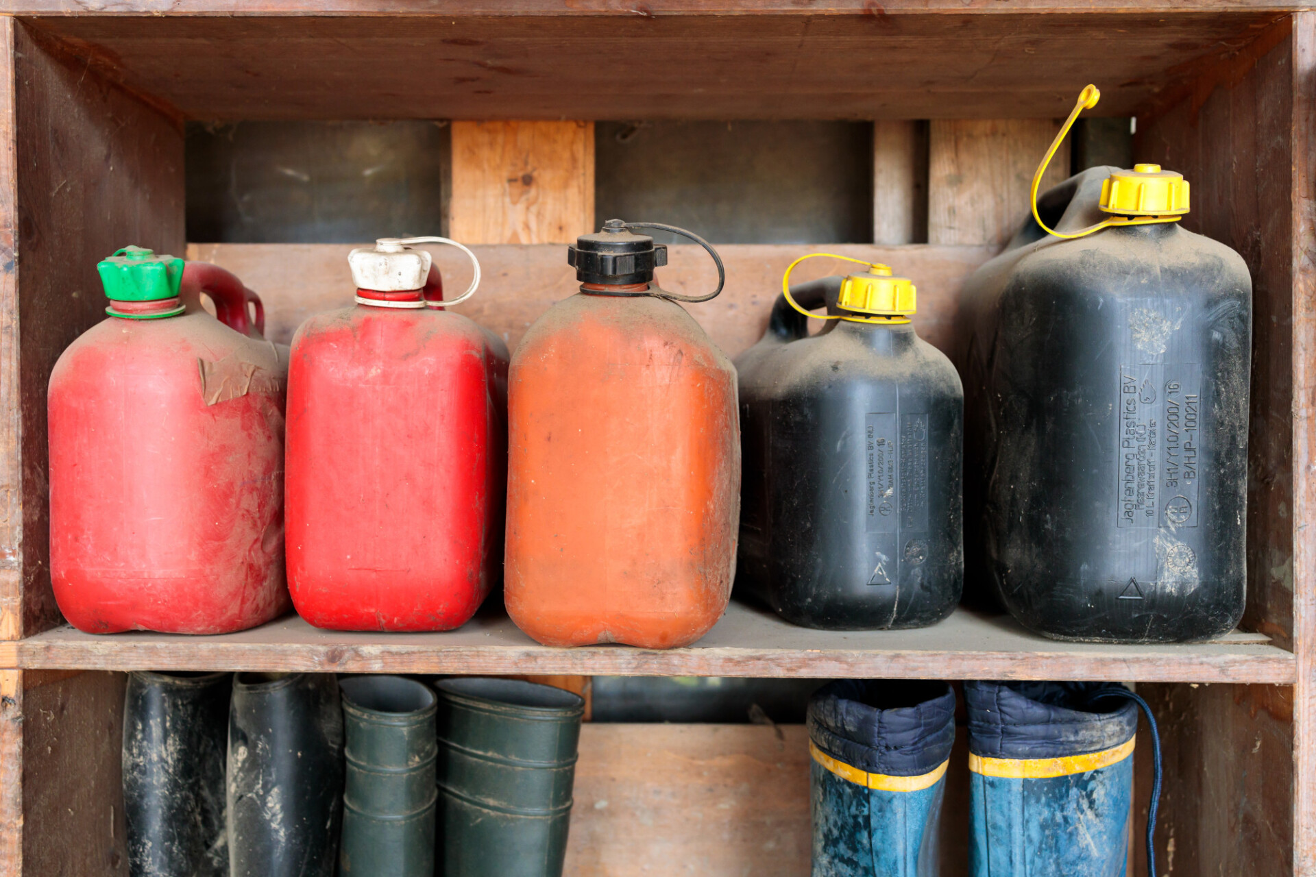 Old petrol cans on a shelf