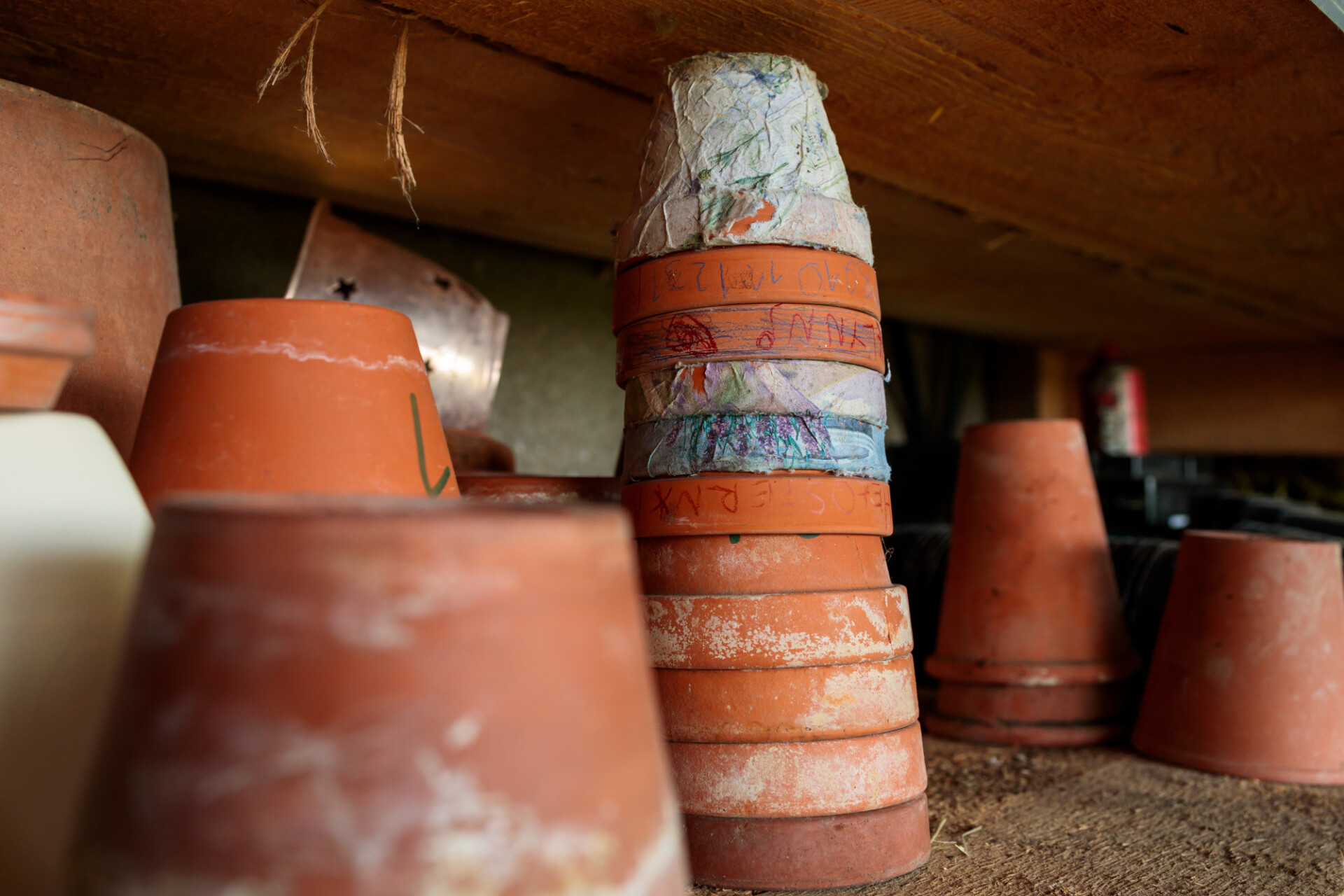 Flower pots stacked on top of each other on a shelf