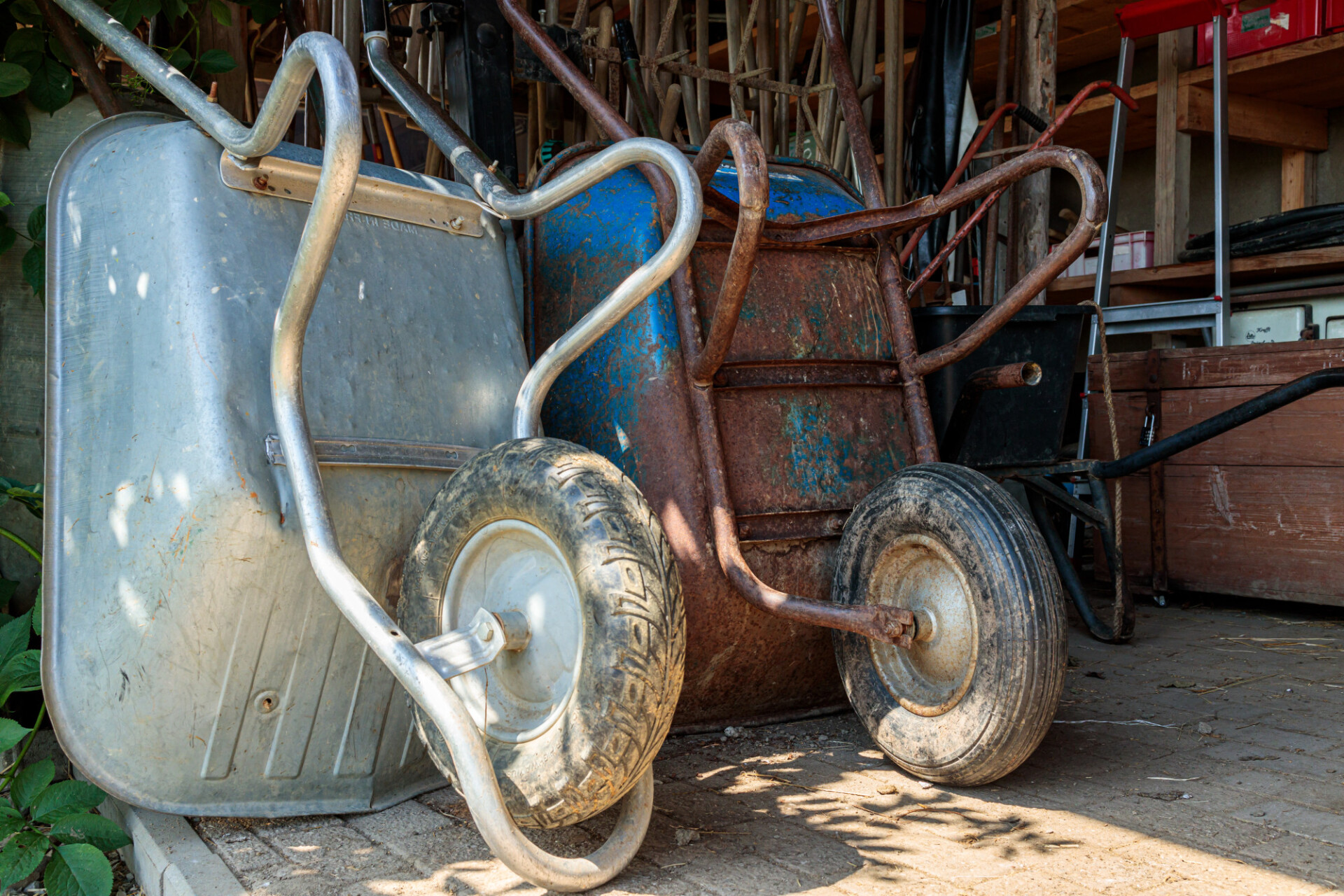 Old wheelbarrows in a barn