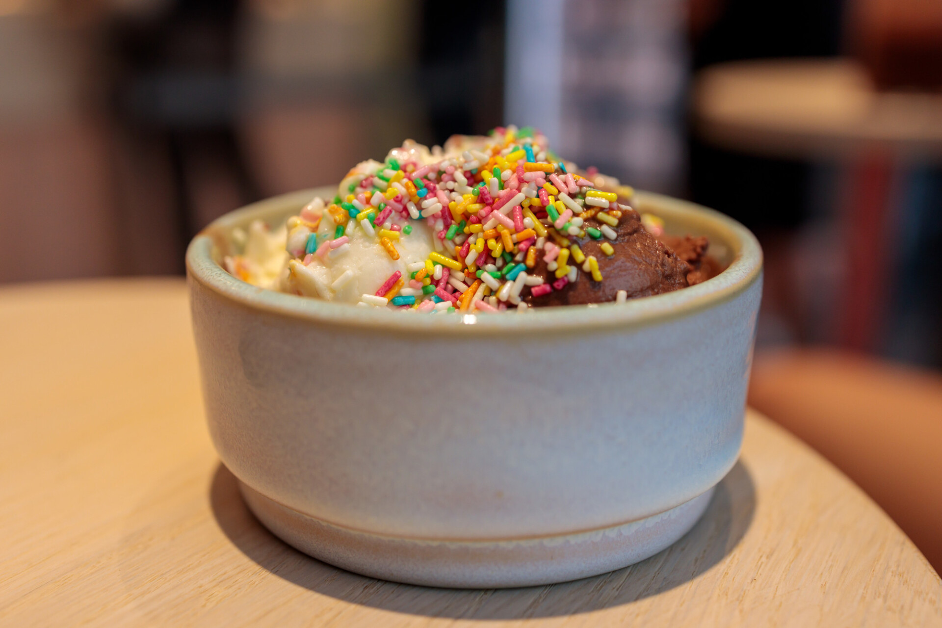 Vanilla and chocolate ice cream with colorful sprinkles