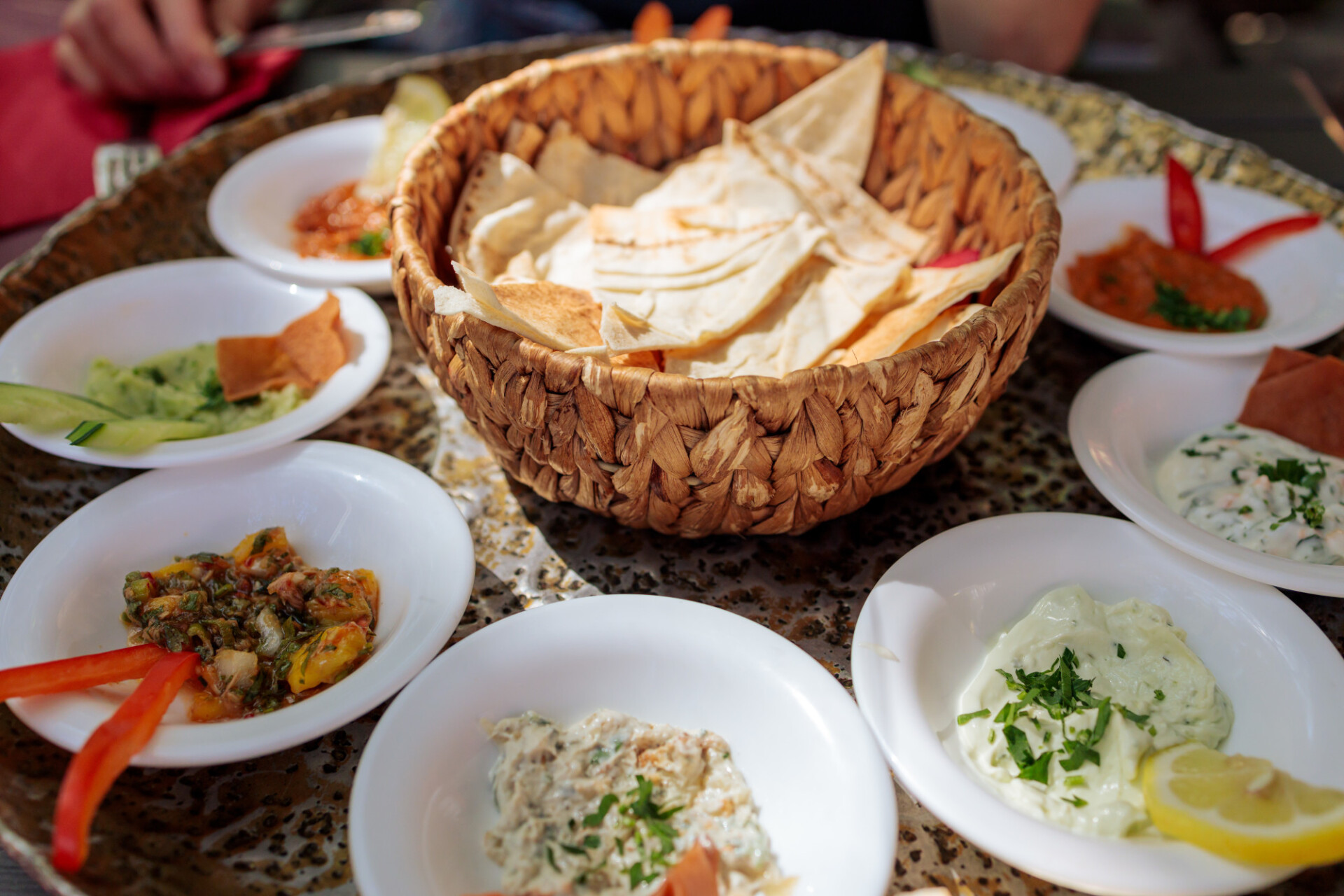 Arabic appetizer plate with dips and pita bread