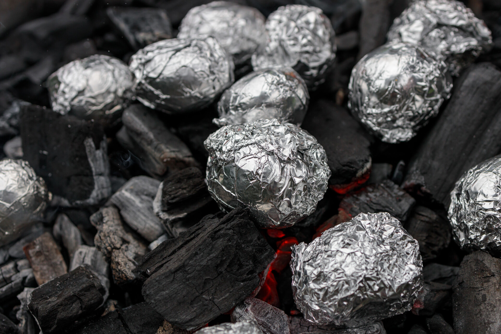 Jacket potato on glowing coals