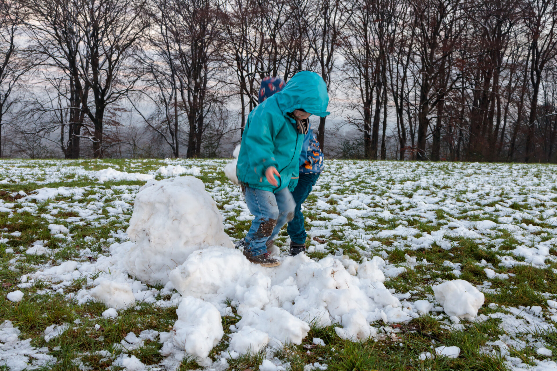 Two little boys playing in the snow