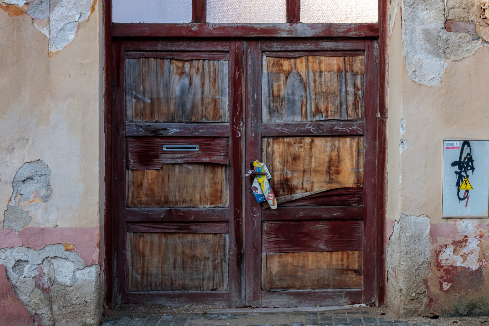 Old wooden gate of an abandoned building