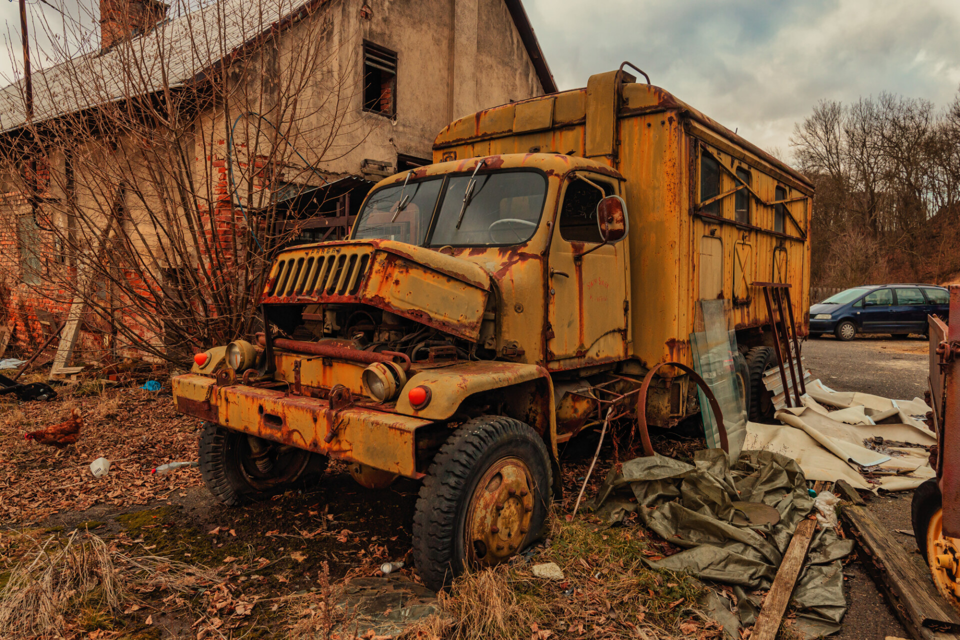 Wreck of a yellow old truck