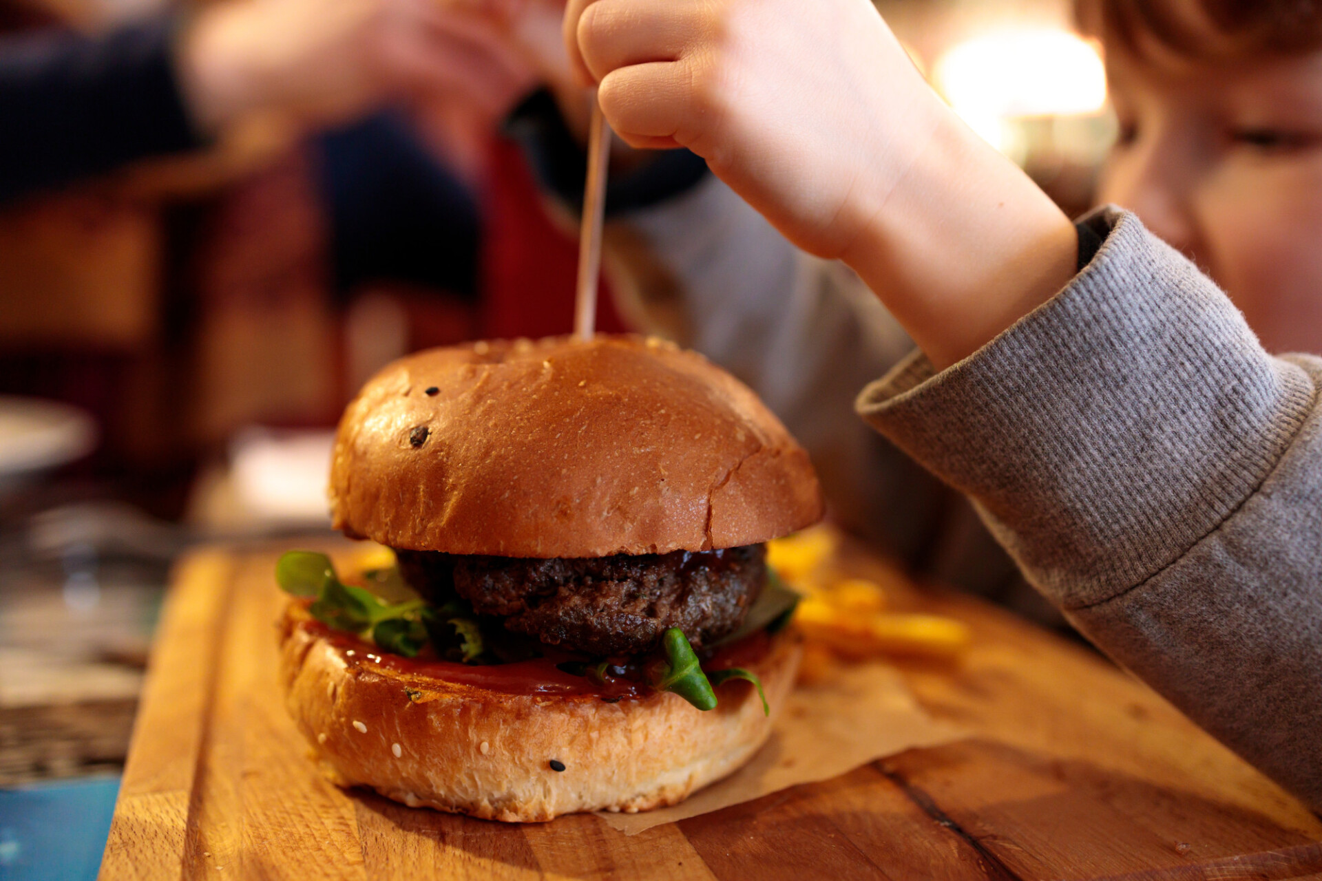 Child eats a burger