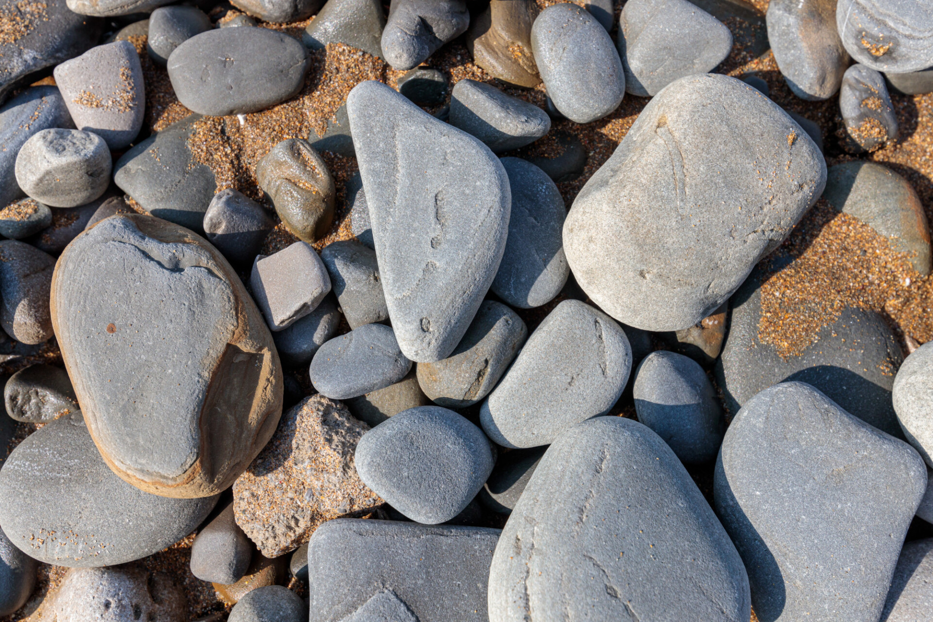 Pebbles by the sea polished by the water