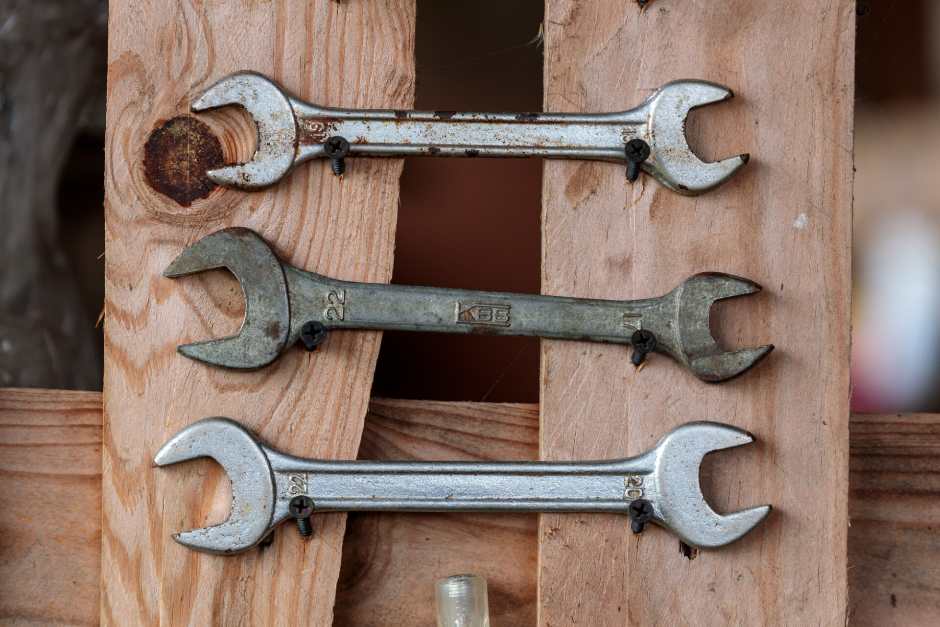 Spanners on a wooden wall