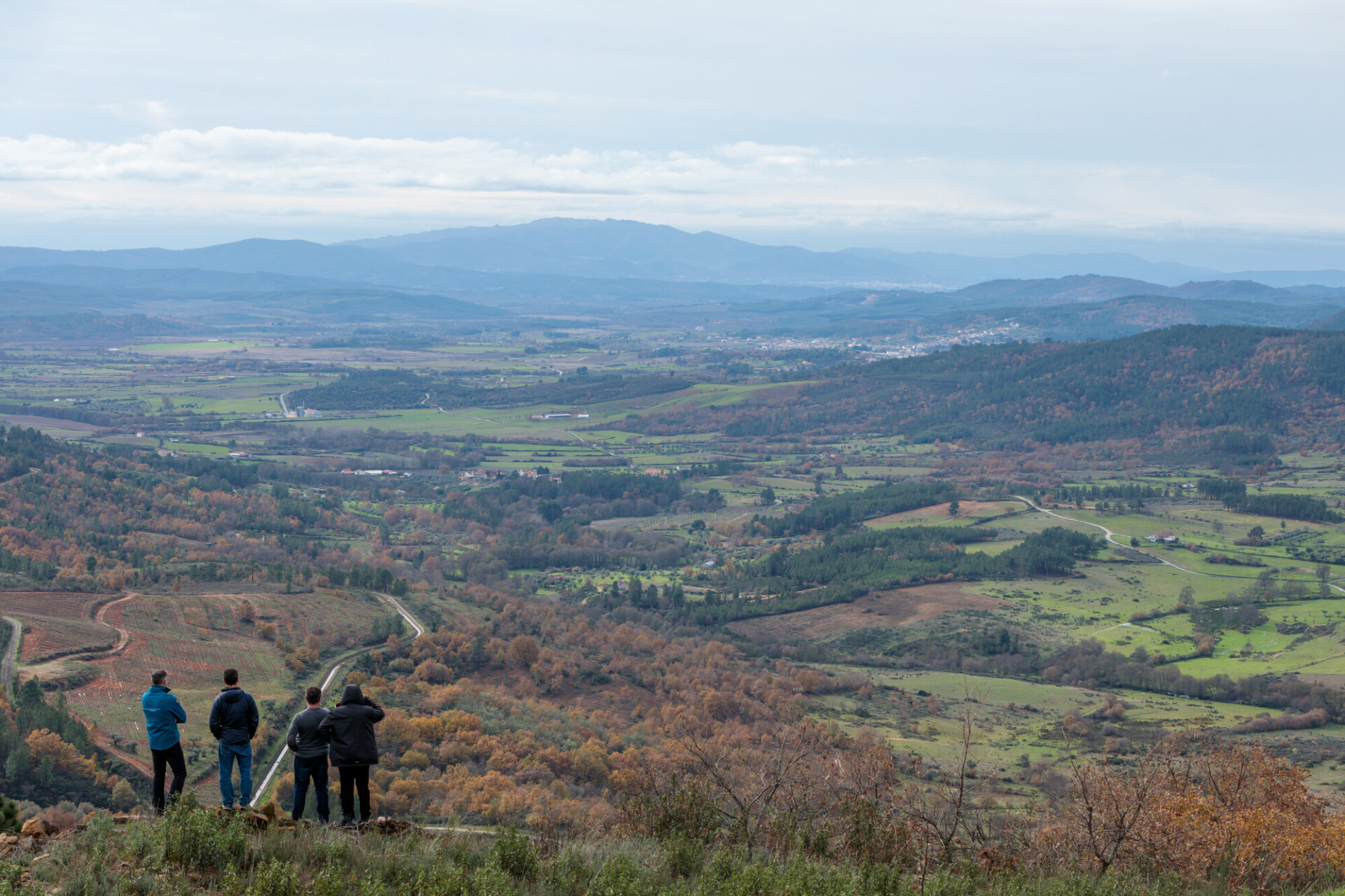 Hikers on the top of the mountains of the Serra da Estrela natural park, Star Mountain Range, glacier valley and mountain landscape