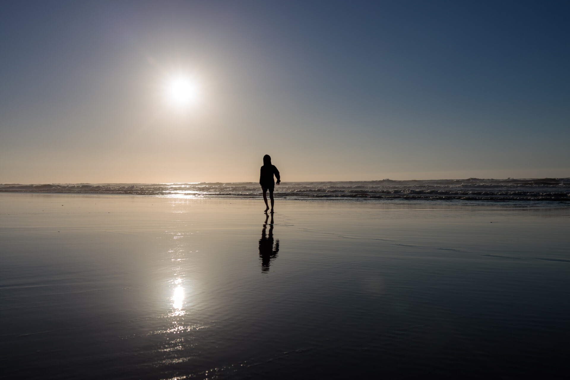 silhouette of a children on the beach in portugal nazare