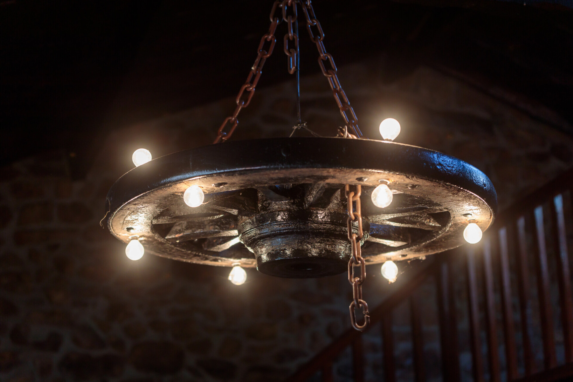 Elegant Fusion: Chandelier Crafted from an Old Carriage Wheel